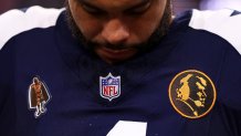 ARLINGTON, TX - NOVEMBER 23: A detail shot of a John Madden Thanksgiving commemorative patch on the jersey of Dak Prescott #4 of the Dallas Cowboys prior to an NFL football game against the Washington Commanders at AT&T Stadium on November 23, 2023 in Arlington, Texas. 