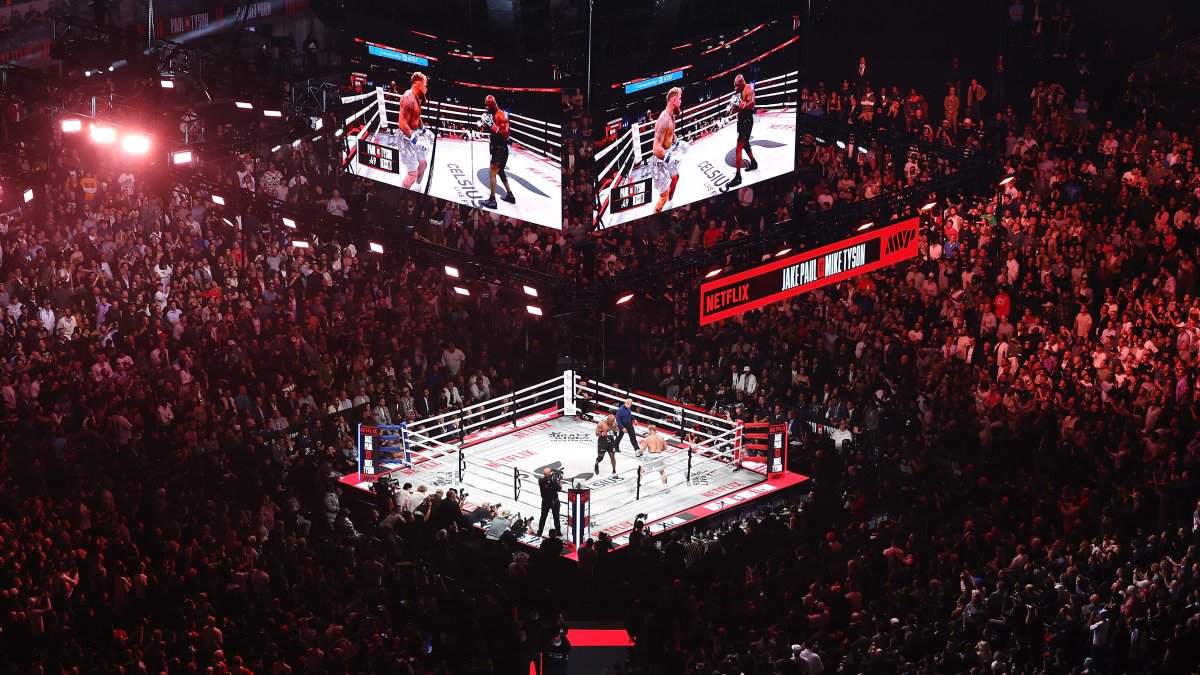 'a boxing ring with people in the middle'