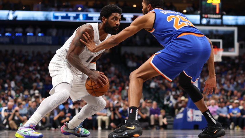 DALLAS, TEXAS – NOVEMBER 27: Kyrie Irving #11 of the Dallas Mavericks is defended by Mikal Bridges #25 of the New York Knicks during the second half at American Airlines Center on November 27, 2024 in Dallas, Texas.