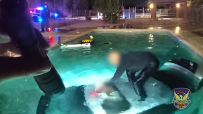 WATCH: Officer rescues man after car plunges into pool