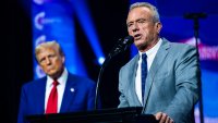 Robert F. Kennedy Jr. speaks with Donald Trump at a Turning Point Action Rally in Duluth, Georgia on Wednesday, Oct. 23, 2024.