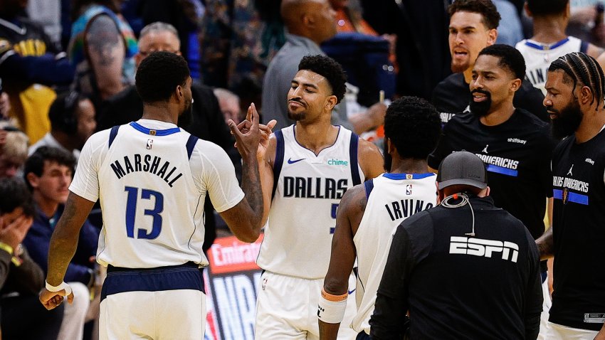 Nov 22, 2024; Denver, Colorado, USA; Dallas Mavericks forward Naji Marshall (13) reacts with guard Quentin Grimes (5) after a play in the fourth quarter against the Denver Nuggets at Ball Arena. (Mandatory Credit: Isaiah J. Downing-Imagn Images)