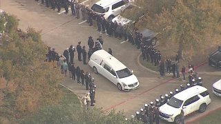 Officers line up for a procession for slain Greenville police officer Cooper Dawson who was killed in the line of duty on Monday, Nov. 25, 2024.