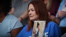 Jan Webster holds up a photograph of her sister Cheryl Springfield in November 2024.