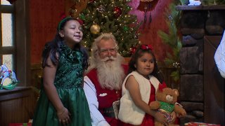 Santa Claus arrives at NorthPark Mall in Dallas, Friday, Nov. 29, 2024.