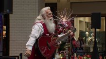 Santa Claus arrives at NorthPark Mall in Dallas, Friday, Nov. 29, 2024.