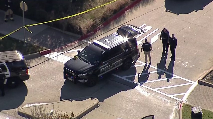 Police investigate a crash and gunfire in Southlake, Texas, Friday, Nov. 22, 2024.