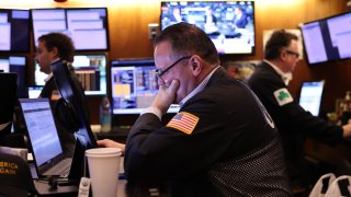 A trader works on the floor of the New York Stock Exchange during the opening bell on Nov. 26, 2024.