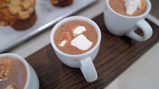 A worker prepares a flight of drinking chocolate for a customer at Katherine Anne Confections, an artisanal chocolate shop and cafe on February 02, 2024 in Chicago, Illinois.