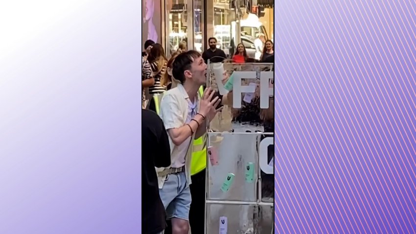 A man with his tongue stuck to an ice sculpture