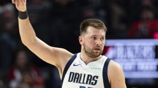 Dallas Mavericks guard Luka Doncic reacts to the foul call against the Portland Trail Blazers during the first half of an NBA basketball game, Sunday, Dec. 1, 2024, in Portland, Ore. (AP Photo/Howard Lao)