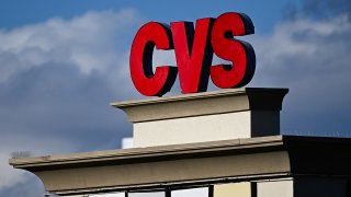 The CVS pharmacy logo is displayed on a sign above a CVS Health Corp. store in Las Vegas, Nevada on February 7, 2024. (Photo by Patrick T. Fallon / AFP) (Photo by