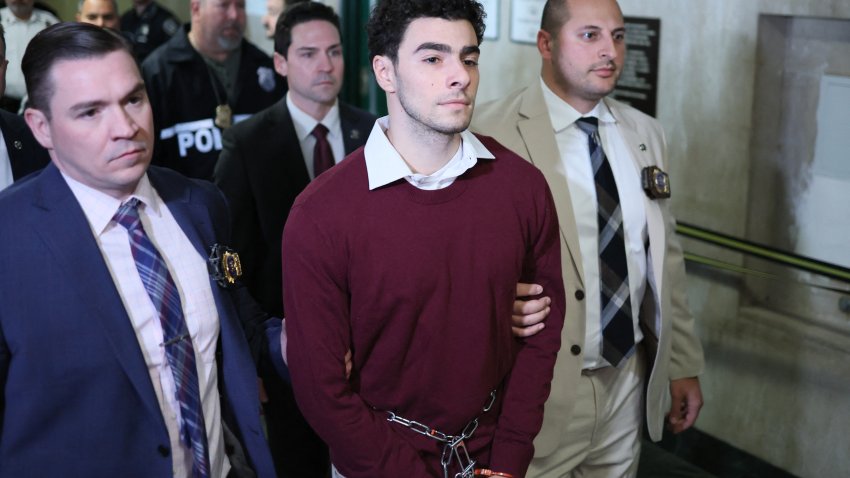 Luigi Nicholas Mangione (C) arrives at Manhattan Criminal Court in New York on December 23, 2024. Mangione, 26, is accused of shooting UnitedHealthcare chief executive Brian Thompson on a Manhattan street on December 4. (Photo by CHARLY TRIBALLEAU / AFP) (Photo by CHARLY TRIBALLEAU/AFP via Getty Images)