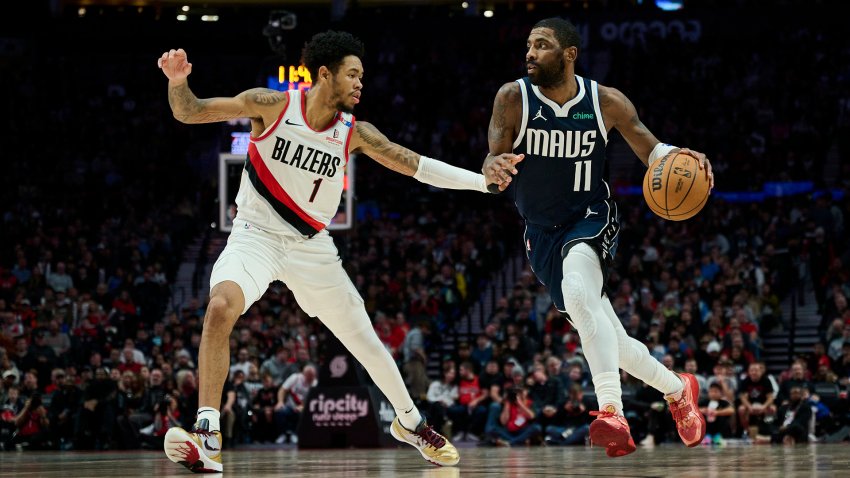 Dec 28, 2024; Portland, Oregon, USA; Dallas Mavericks guard Kyrie Irving (11) drives to the basket during the second half against Portland Trail Blazers guard Anfernee Simons (1) at Moda Center. Mandatory Credit: Troy Wayrynen-Imagn Images