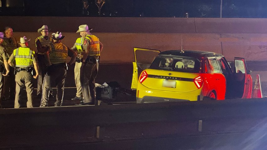 Texas State Troopers investigate a crash where at trooper was hit by a driver early Monday, Dec. 16, 2024.