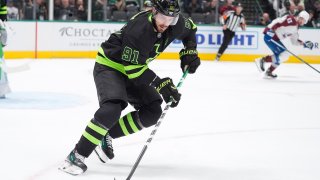 Dallas Stars center Tyler Seguin (91) skates with the puck during the second period of an NHL hockey game against the Colorado Avalanche, Friday, Nov. 29, 2024, in Dallas. (AP Photo/LM Otero)