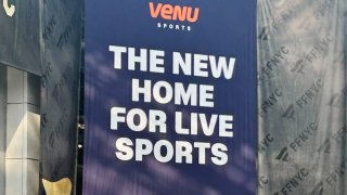 An advertisement for Venu Sports, the sports streaming venture by Disney, Warner Bros. Discovery and Fox, hangs at the Fanatics Fest event in New York City on Aug. 16, 2024.