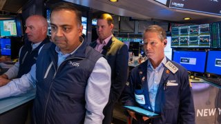 Traders work on the floor of the New York Stock Exchange (NYSE) on the first day of trading of the new year on January 02, 2025 in New York City. 