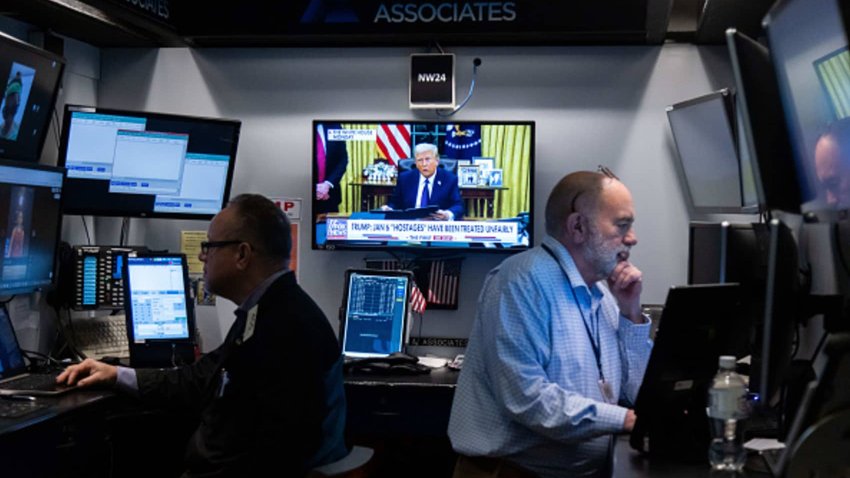 U.S. President Donald Trump on television during a news broadcast, on the floor of the New York Stock Exchange, on Jan. 21, 2025.