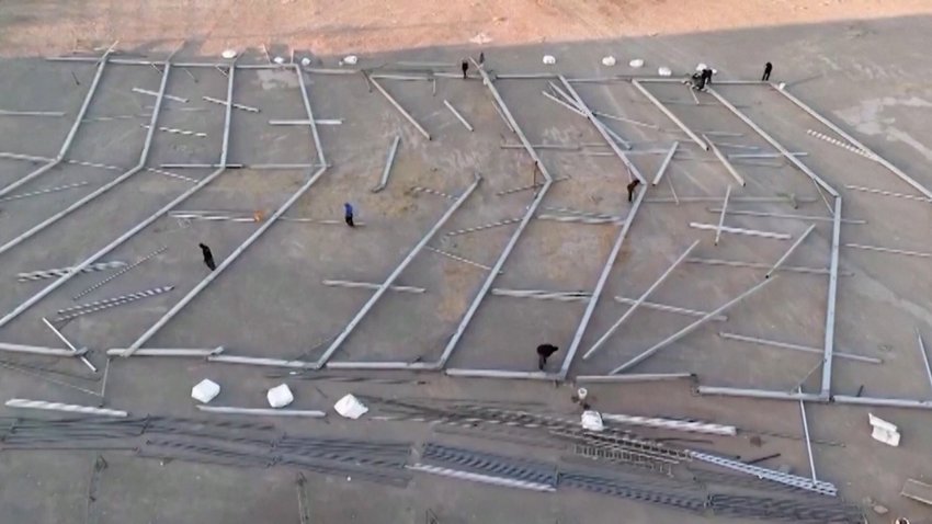 Workers building tents in Mexico.