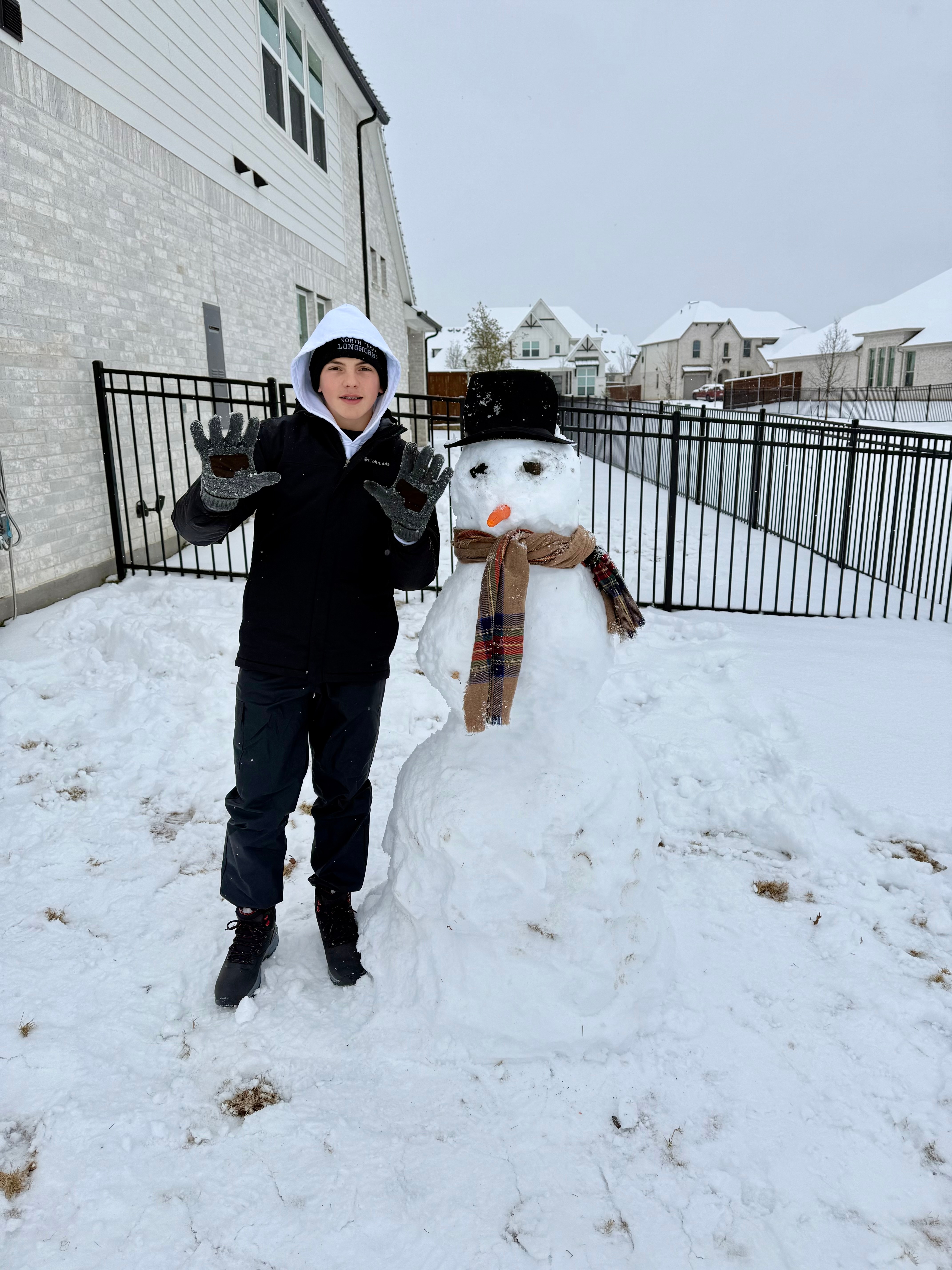 Enjoying the snow out in Prosper…building snowmen!