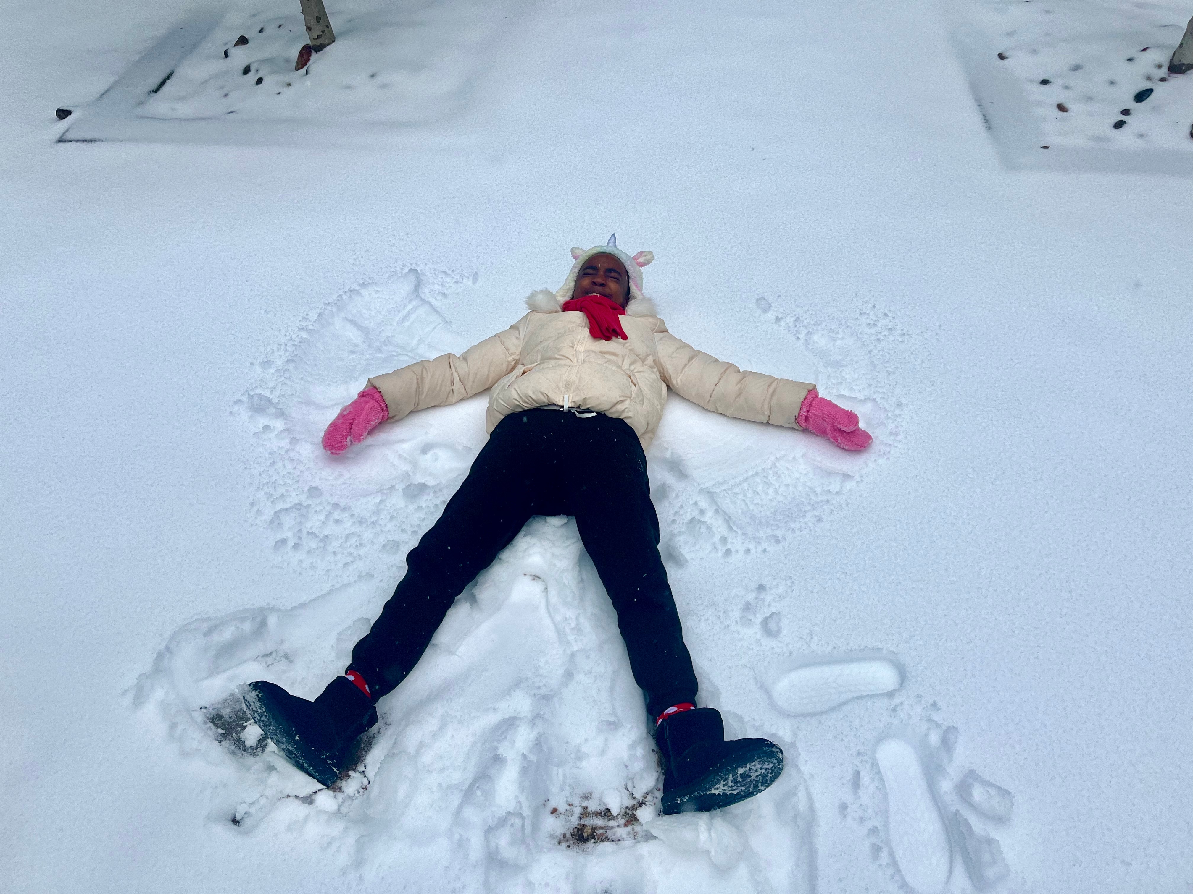 My daughter Anaya making snow angels in McKinney! Enjoying her snow day!