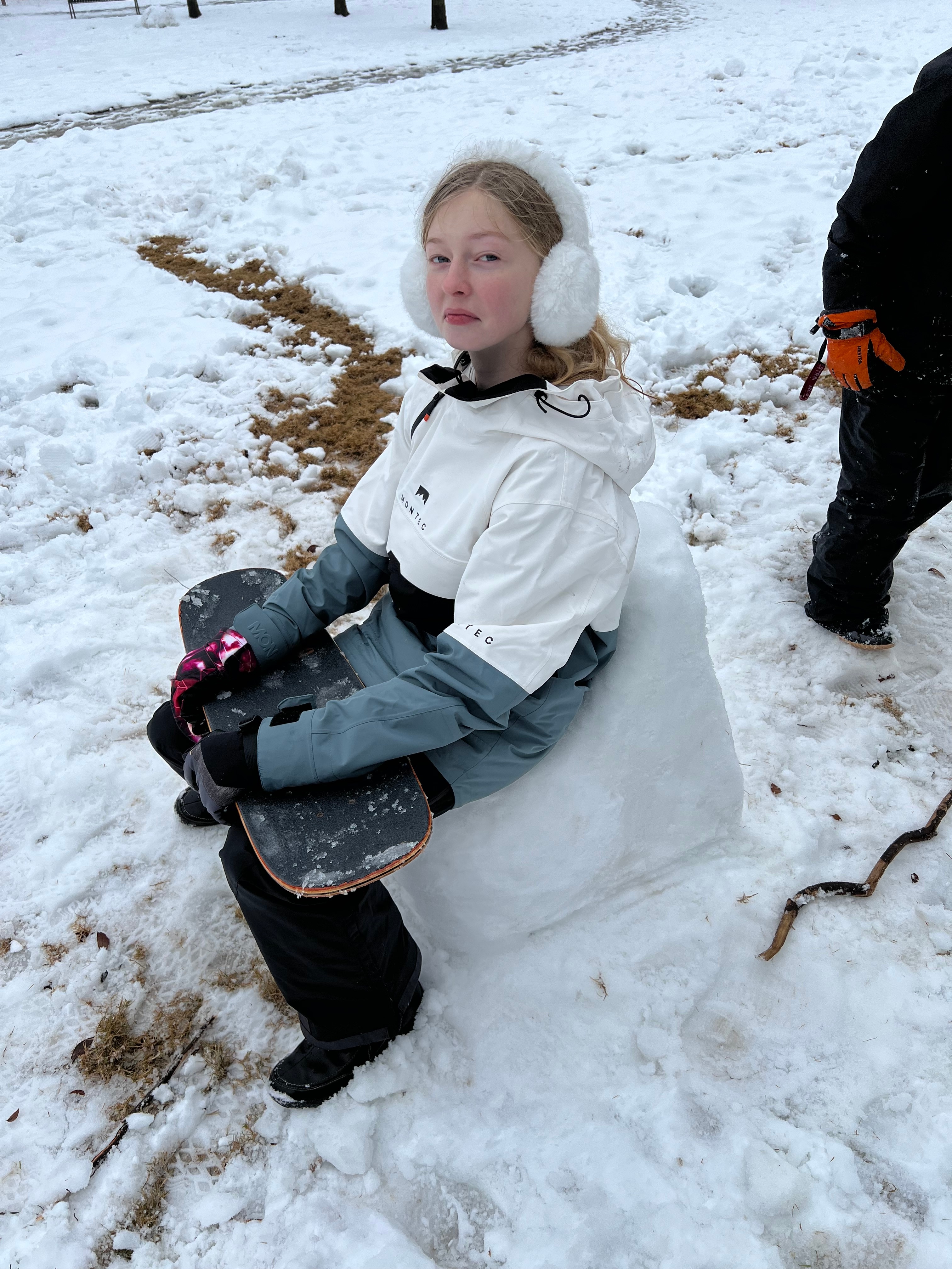 Kids making a snow toilet