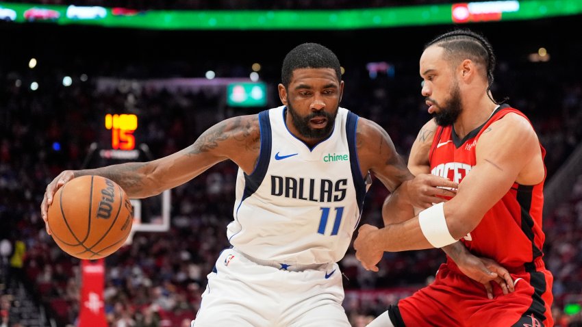 Dallas Mavericks’ Kyrie Irving (11) is defended by Houston Rockets’ Dillon Brooks during the first half of an NBA basketball game Wednesday, Jan. 1, 2025, in Houston.