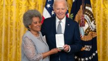 President Joe Biden awards the Presidential Citizens Medal to Rupa Redding-Lallinger on behalf of Louis Redding during a ceremony in the East Room at the White House, Thursday, Jan. 2, 2025, in Washington. (AP Photo/Mark Schiefelbein)