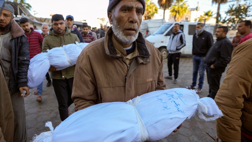 Abdallah Abu Libda carries the body of his 6-month-old nephew