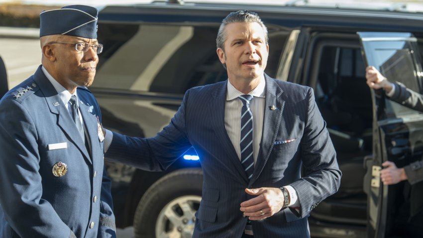 Defense Secretary Pete Hegseth pats Chairman of the Joint Chiefs of Staff Gen. Charles Q. Brown Jr.