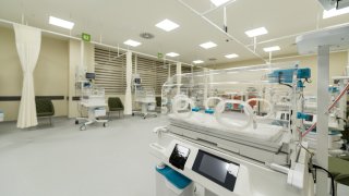 hospital room featuring multiple empty incubators