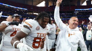 ATLANTA, GEORGIA – JANUARY 01: Head coach Steve Sarkisian of the Texas Longhorns celebrates with his team after defeating the Arizona State Sun Devils 39-31 during the second overtime in the Chick-fil-A Peach Bowl at Mercedes-Benz Stadium on January 01, 2025 in Atlanta, Georgia.