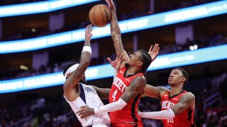 HOUSTON, TEXAS – JANUARY 01: Jalen Green #4 of the Houston Rockets blocks a shot from Jaden Hardy #1 of the Dallas Mavericks during the first half at Toyota Center on January 01, 2025 in Houston, Texas.