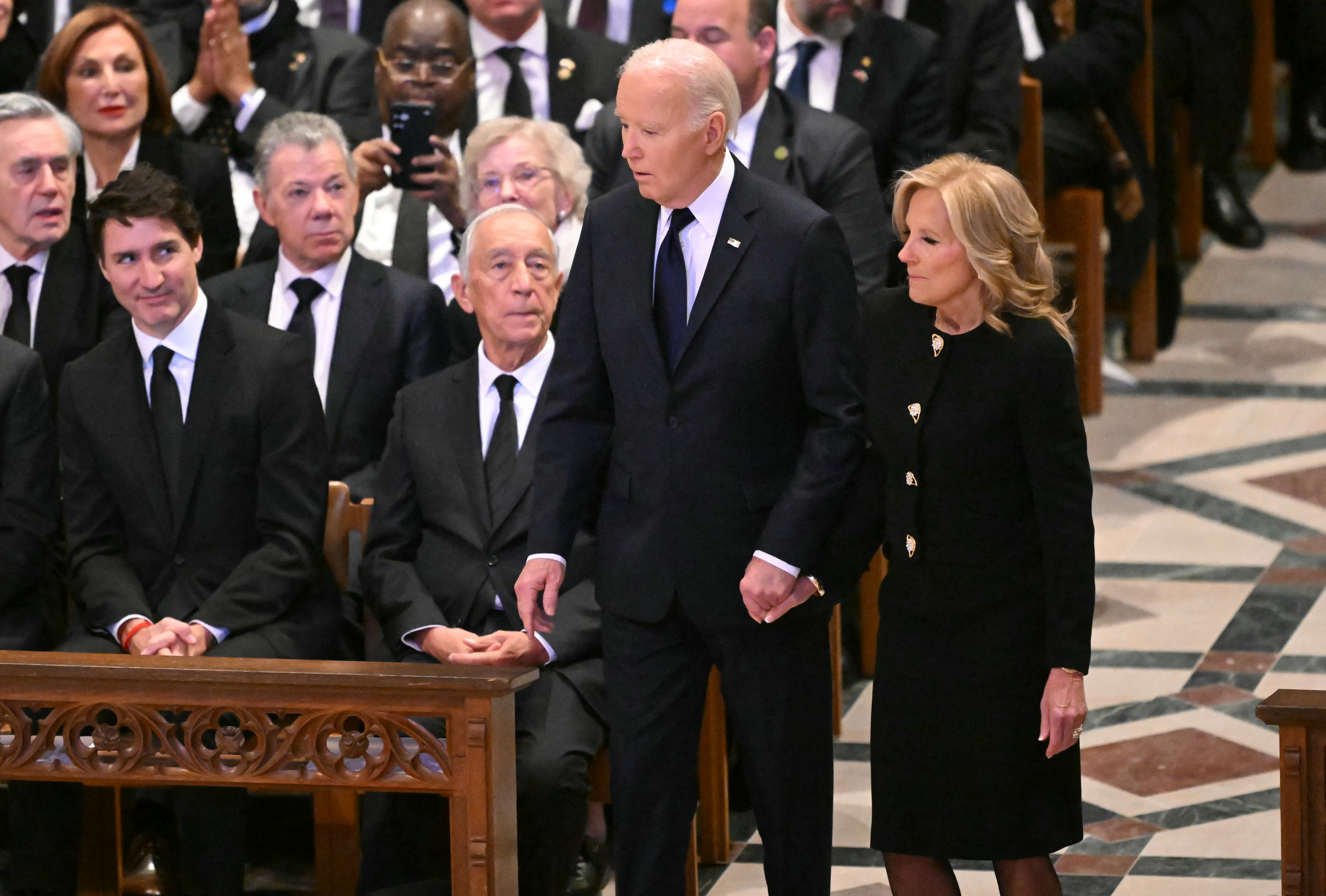 US President Joe Biden and First Lady Jill Biden arrive for the State Funeral Service for former US President Jimmy Carter at the Washington National Cathedral in Washington, DC, on January 9, 2025.