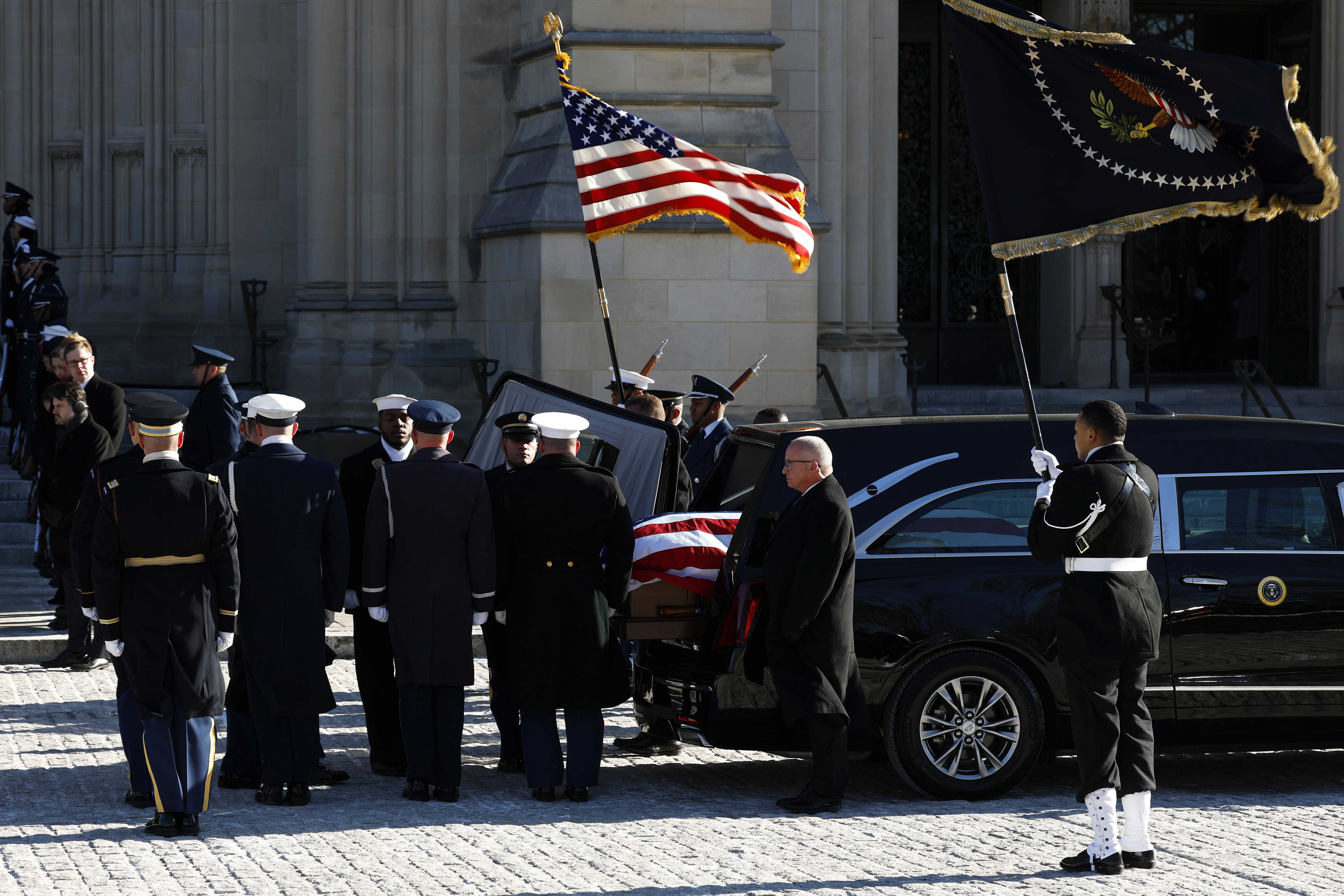 U.S. Military Body Bearers carry the casket bearing the remains of former U.S. President Jimmy Carter into the Washington National Cathedral for his state funeral on January 9, 2025 in Washington, DC.