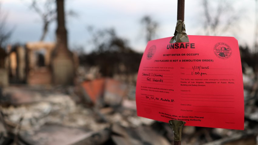 ALTADENA, CALIFORNIA - JANUARY 17: An 'Unsafe' red tag noticed is posted at a home which burned in the Eaton Fire on January 17, 2025 in Altadena, California. Multiple wildfires which were fueled by intense Santa Ana Winds have burned across Los Angeles County leaving at least 27 dead with over 180,000 people having been under evacuation orders. Over 12,000 structures have been burned in the Palisades and Eaton Fires. (Photo by Mario Tama/Getty Images)