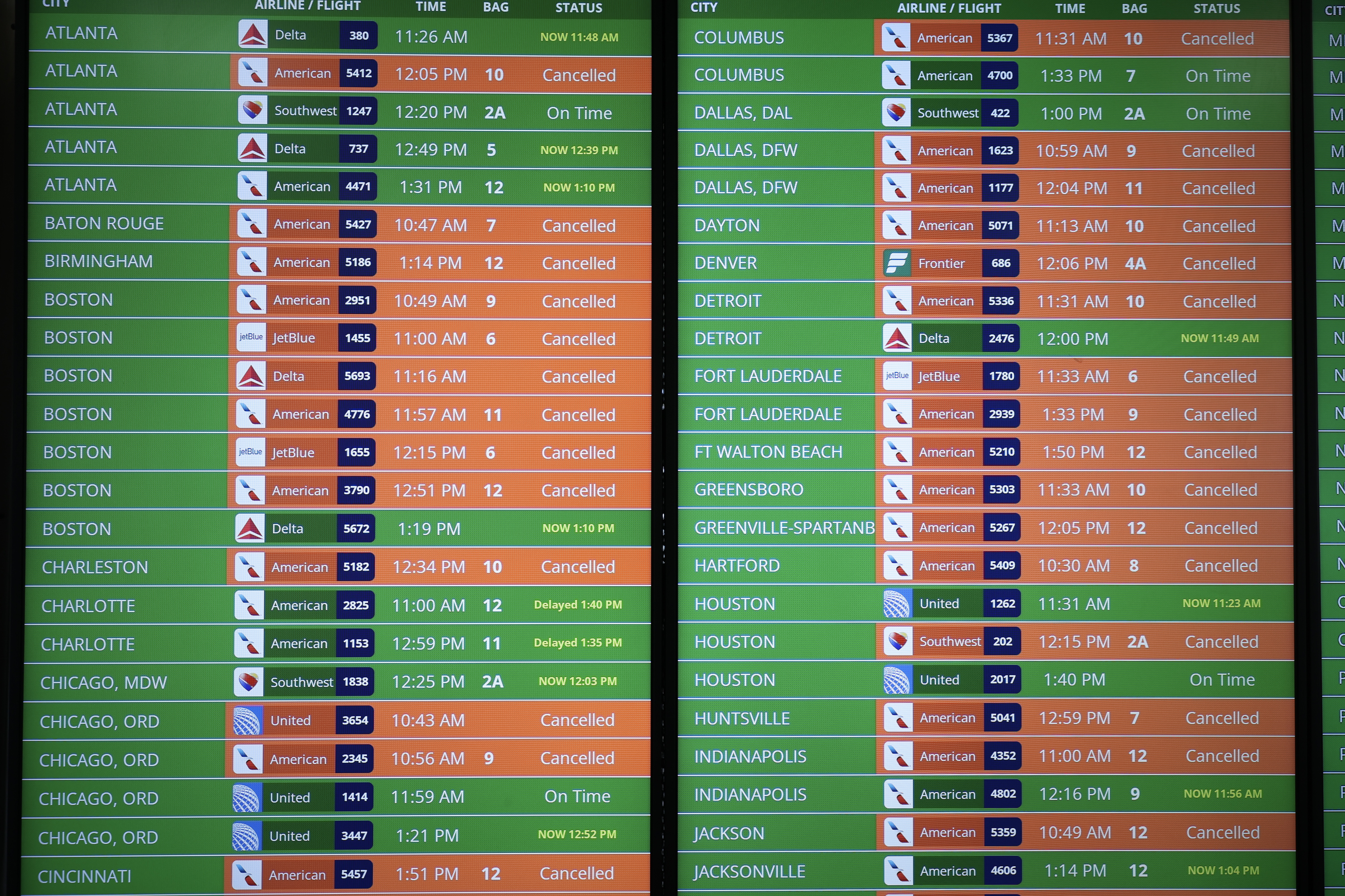 A flight information board shows cancelled and delayed flights at the Reagan National Airport on Jan. 30, 2025.