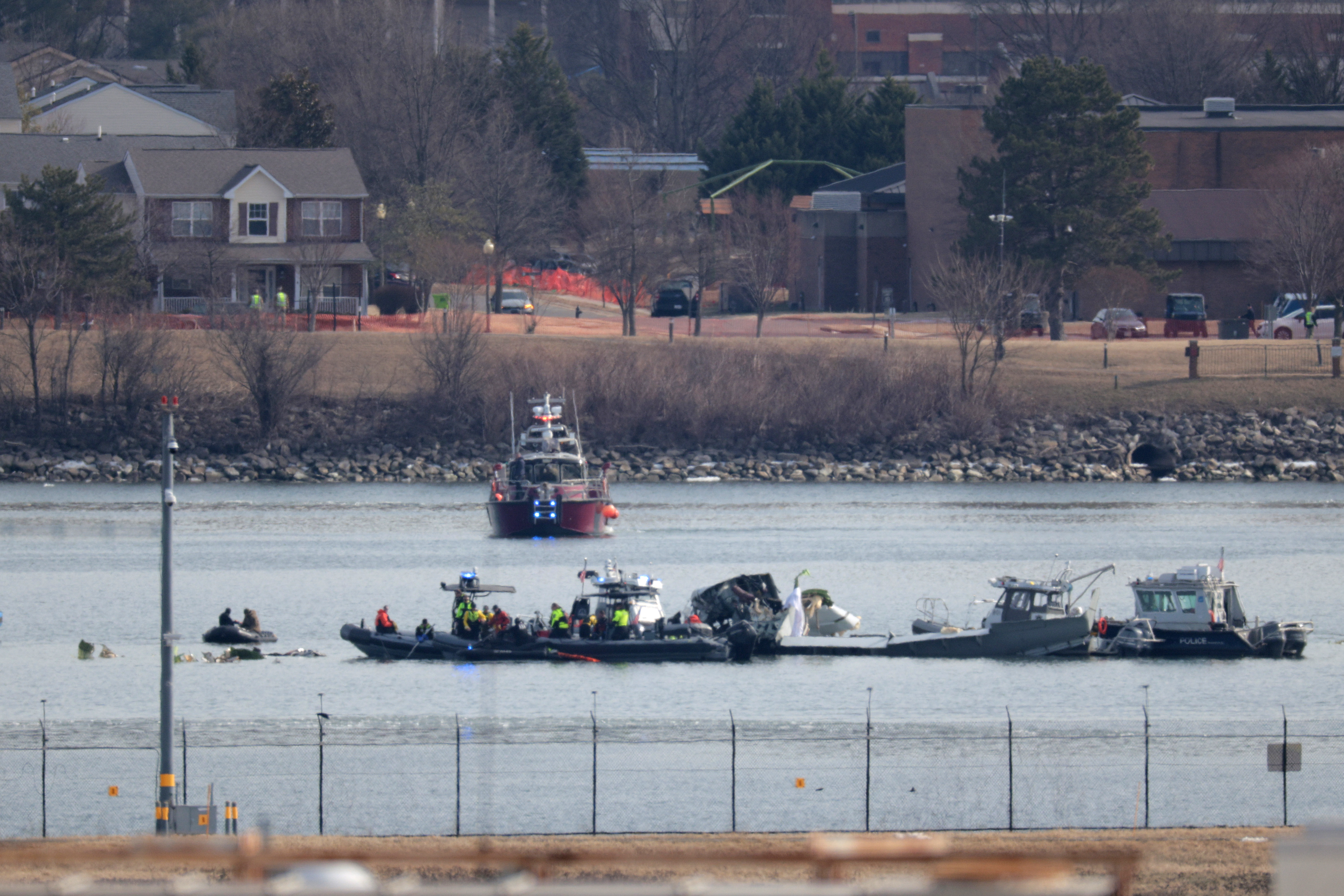 Emergency response units search the crash site of the American Airlines plane on Jan. 30, 2025.