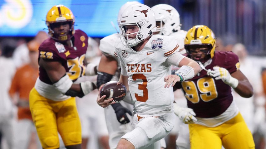 Jan 1, 2025; Atlanta, GA, USA; Texas Longhorns quarterback Quinn Ewers (3) runs with the ball against the Arizona State Sun Devils during the second half of the Peach Bowl at Mercedes-Benz Stadium.