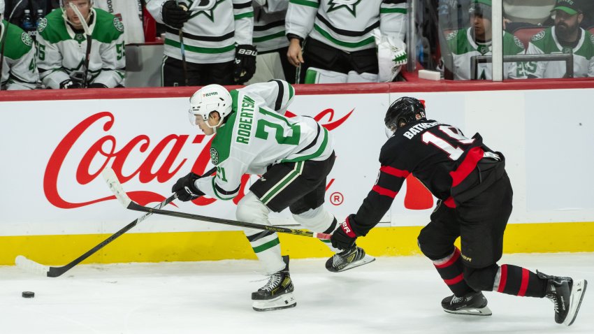 Jan 12, 2025; Ottawa, Ontario, CAN; Dallas Stars left wing Jason Robertson (21) skates with the puck in front of  Ottawa Senators right wing Drake batherson (19) in the third period at the Canadian Tire Centre. Mandatory Credit: Marc DesRosiers-Imagn Images