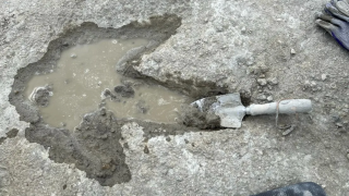 A dinosaur footprint uncovered at Dewars Farm Quarry in Oxfordshire, England.