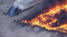 A tractor truck caught fire and spread to stacks of polypropylene pallets at rural repair facility in Wilmer, Texas, on Wednesday, Jan. 8, 2025.