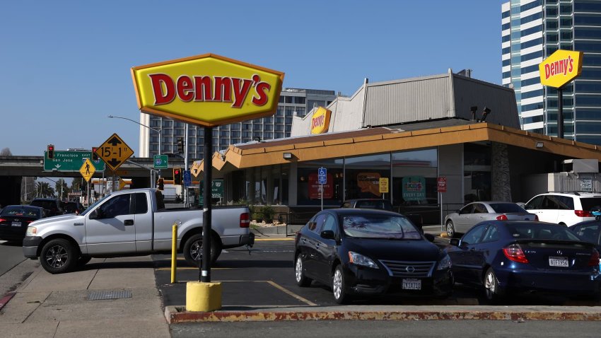 A sign is posted in front of a Denny’s restaurant in Emeryville, California, on Feb. 13, 2023.