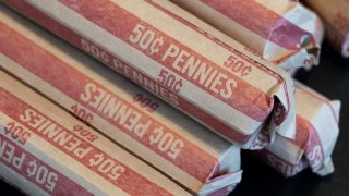 Rolls of US pennies are seen in this photo illustration in Washington, DC, February 10, 2025.
