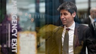 Sam Altman, CEO of OpenAI, at Station F, is seen through glass, during an event on the sidelines of the Artificial Intelligence Action Summit in Paris, France, Feb. 11, 2025. 