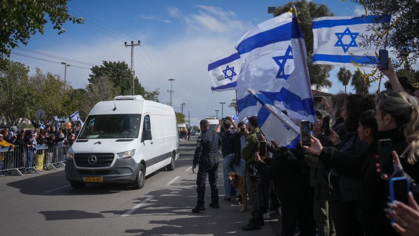 A convoy carrying the coffins of four bodies arrives at the Abu Kabir Forensic Institute in Tel Aviv, Israel, Thursday, Feb. 20, 2025, after they were handed over by Hamas in Gaza. Israel has identified three of the bodies as hostages and said the other was of an unknown person.