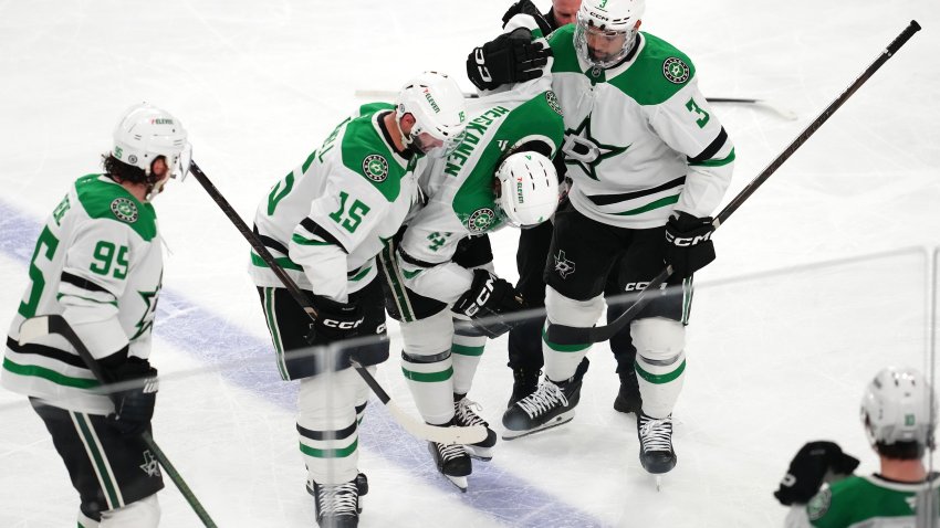 Jan 28, 2025; Las Vegas, Nevada, USA; Dallas Stars defenseman Miro Heiskanen (4) is helped off the ice by center Colin Blackwell (15) and defenseman Mathew Dumba (3) after sustaining an injury from a trip by Vegas Golden Knights right wing Mark Stone (not pictured) during the third period at T-Mobile Arena. Mandatory Credit: Stephen R. Sylvanie-Imagn Images