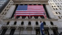 U.S. flags hang on the building of the New York Stock Exchange (NYSE), after U.S. President-elect Donald Trump won the presidential election, in New York City, U.S., November 6, 2024. 