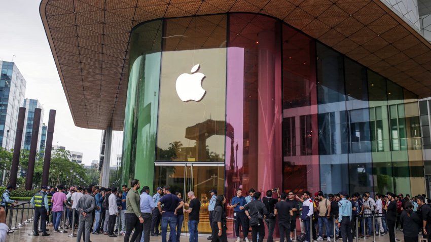 Customers queue outside an Apple store ahead of its opening hours during the first day of sale of the iPhone 15 smartphone in Mumbai, India, on Friday, Sept. 22, 2023. 